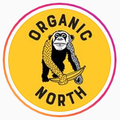 The Organic north logo, a monkey holding a banana with the text "organic north" written around it